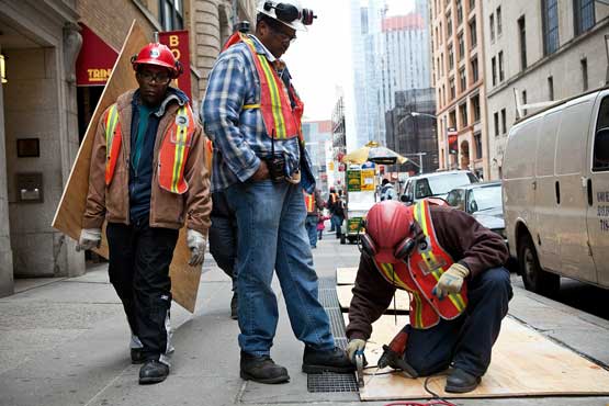 Construction workers cover air vents that could cause the New York subway system to flood in preperation for Hurricane Sandy on October 28, 2012 in New York, United States. The MTA has announced that at 7:00 PM EST they plan an orderly shutdown and suspension of all subway, bus and commuter railroad service in reponse to the storm. Sandy, which has already claimed over 50 lives in the Caribbean, is predicted to bring heavy winds and floodwaters as the mid-atlantic region prepares for the damage (Getty Images/AFP)