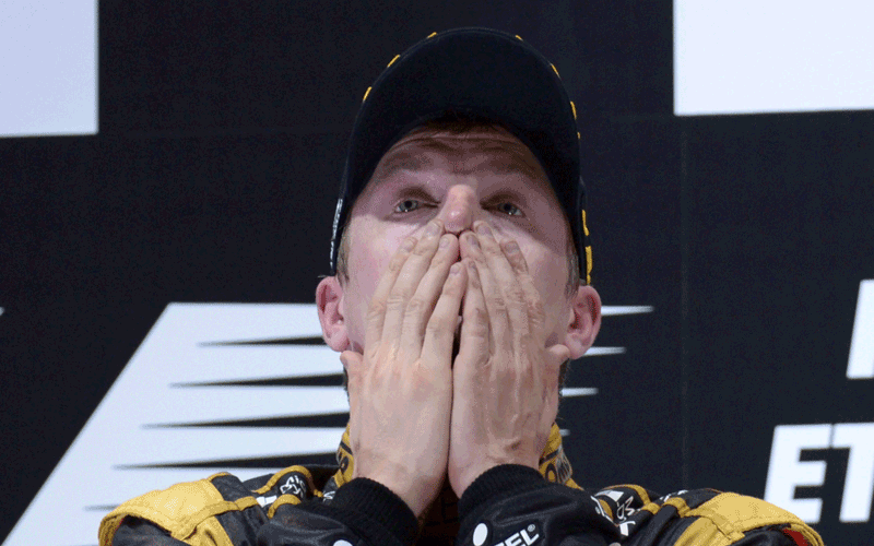 Lotus F1 Team's Finnish driver Kimi Raikkonen celebrates on the podium at the Yas Marina circuit on November 4, 2012 in Abu Dhabi after the Abu Dhabi Formula One Grand Prix. (AFP)