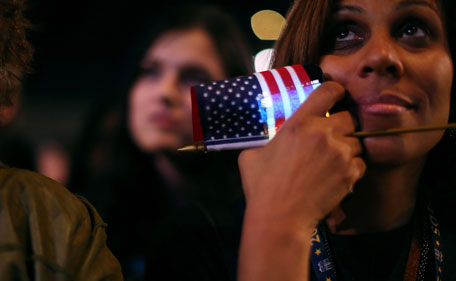 US President Barack Obama supporter celebrates as she watches voting results on election night November 6, 2012 in Chicago, Illinois.  (AFP)