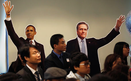 People watch a television screen during a US Election party hosted by Democrats Abroad UK at Sports Bar & Grill Marylebone in London on November 6, 2012.  Barack Obama and Mitt Romney steeled themselves for nervous hours as polls closed in the first of the key swing states that will decide their tight and bitter White House duel.  (AFP)