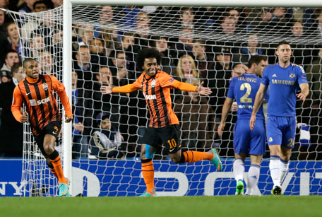 Shakhtar Donetsk's Willian (centre) celebrates after scoring a goal against Chelsea during their Champions League group E match at Stamford Bridge stadium in London, on Nov. 7, 2012. (AP)