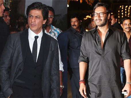 Bollywood actor Shah Rukh Khan and Ajay Devgn attend director Rohit Shetty's sister's wedding. (AFP)