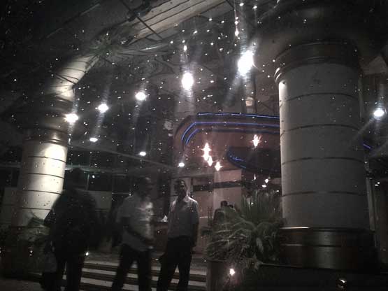 Dubai residents take a shelter during heavy rain on Thursday evening (Bindu Suresh Rai)