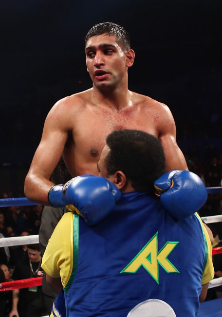 Amir Khan of Great Britain celebrates his victory over Carlos Molina following their vacant WBC Silver Super Lightweight title fight at Los Angeles Sports Arena on December 15, 2012 in Los Angeles, California. (GETTY)