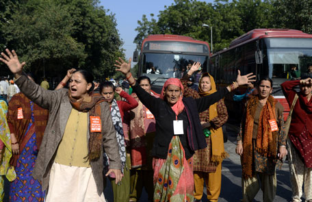 National Federation of Indian Women activists shout slogans during a protest following the gang-rape of a student in New Delhi on December 18, 2012. Indian police December 17 arrested the driver of a bus after a student was gang-raped and thrown out of the vehicle, reports said, in an attack that has sparked fresh concern for women's safety in New Delhi. The attack sparked new calls for greater security for women in New Delhi, which registered 568 rapes in 2011 compared with 218 in India's financial capital Mumbai the same year. (AFP)