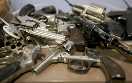 Assorted hand guns turned in during a gun buyback event are seen at the Bridgeport Police Department's Community Services Division in Bridgeport, Connecticut, in the wake of the shootings at Sandy Hook Elementary School, December 22, 2012. (REUTERS)