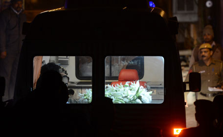 An ambulance transporting the body of a gang-rape victim is seen outside her residence in New Delhi on December 30, 2012. The body of a gang-rape victim arrived back in New Delhi on December 30 after her death from sickening injuries in a Singapore hospital as India was engulfed by a mass outpouring of grief and anger. (AFP)