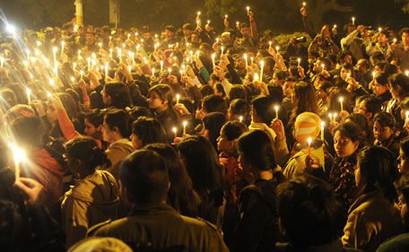 Indian protesters hold candles during a rally in New Delhi late December 29,2012, after the death of a gang rape victim from the Indian capital. Indian leaders appealed for calm and security forces headed off fresh unrest by turning New Delhi into a fortress after a student who was savagely gang-raped died in a Singapore hospital. Police threw a ring of steel around the centre of the Indian capital after news of the 23-year-old medical student's death was broken in the early hours by the Singapore hospital that had been treating her for the last two days.  (AFP)