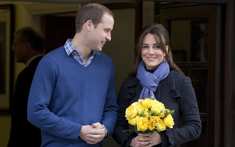 File photo Britain's Prince William stands next to his wife Kate, Duchess of Cambridge as she leaves the King Edward VII hospital in central London. Palace officials say Prince William and the former Kate Middleton’s first baby is due in July and that her condition is improving. (AP)