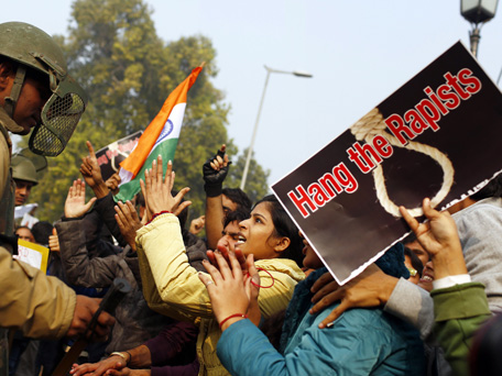 (FILE) December 23, 2012, Indian demonstrators taunts the police during a protest calling for better safety for women following the rape of a student last week, in front the India Gate monument in New Delhi. (AFP)