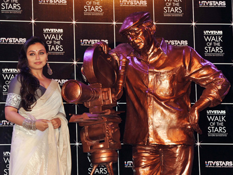 Indian Bollywood actress Rani Mukerji poses during the unveiling of a UTV STARS , walk of the stars, brass statue of late Bollywood legendary filmmaker, script writer, and film producer Yash Chopra in Mumbai on February 11, 2013. (AFP)