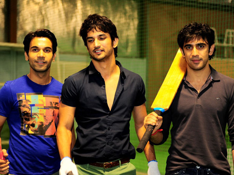 Raj Kumar Yadav (L), Sushant Singh Rajput (C) and Amit Sadh (R), lead cast of Indian film 'Kai Po Che' play a cricket match during their promotional tour in Dubai.