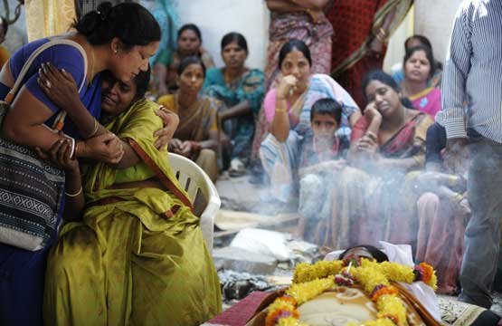 Indian relatives mourn Swapna Reddy who died in a bomb blast the night before in Hyderabad on February 22, 2013. (AFP)