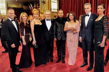 Reliance group's Anil Ambani (5th L) and wife Tina (6th  L) with best actor Oscar winner Daniel Day-Lewis (2nd R), Director Steven Spielberg (4th L) of Dreamworks and other stars of the movie 'Lincoln' at Oscar Awards ceremony in Los Angeles. The movie was co-produced by Reliance and Dreamworks.