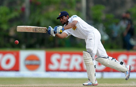 Sri Lankan batsman Tillakaratne Dilshan plays a shot during the fourth day of the first Test against Bangladesh at the Galle International Cricket Stadium in Galle on March 11, 2013. (AFP)