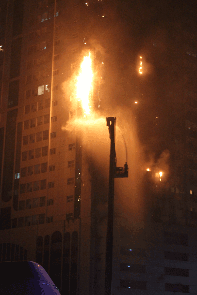 Al Tayer Building in Al Nahda, Sharjah, on fire last April. It was one of the victims of a carelessly thrown cigarette butt or shisha coal cinder (File)