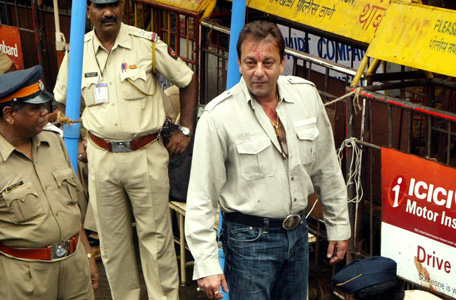 In this June 19, 2007 file photo, Bollywood actor Sanjay Dutt, center, is frisked by a policeman upon his arrival at a special court trying the cases of those accused in the 1993 Mumbai bombings in Mumbai, India. India's Supreme Court has sentenced Dutt to five years in jail for illegal weapons possession in a case linked to the 1993 bombing that killed 257 people in Mumbai. The court on Thursday, March 21, 2013, ordered Dutt to surrender to police within four weeks on the charge of possessing three automatic rifles and a pistol that had been supplied to him by men subsequently convicted in the bombing. (AP)