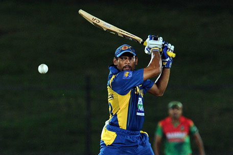 Sri Lankan batsman Tillakaratne Dilshan plays a shot during the opening one-day internationalagainst Bangladesh at the Suriyawewa Mahinda Rajapakse International Cricket Stadium in Hambantota on March 23, 2013. (AFP)