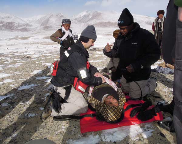 The injured man getting treatment at the airstrip by the medical team (SUPPLIED)