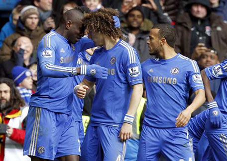 Chelsea's Demba Ba (left) celebrates scoring a goal  with David Luiz (centre) during the FA Cup quarter-final replay against Manchester United at Stamford Bridge stadium in London, England on April 1, 2013. (AFP)