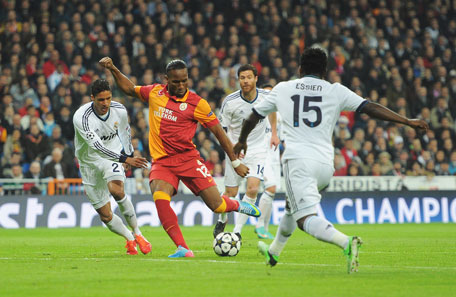 Didier Drogba of Galatasaray shoots at goal under pressure from Raphael Varane (left) of Real Madrid during the UEFA Champions League quarter-final first leg match at Estadio Santiago Bernabeu on April 3, 2013 in Madrid, Spain. (GETTY)