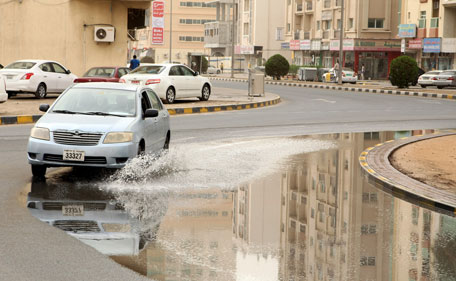 Rainwater collects at a Sahrjah roundabout following rain on April 7, 2013. (CHANDRA BALAN)