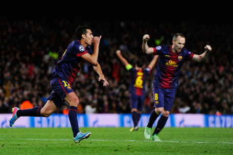 Pedro of Barcelona celebrates scoring the equaliser with Andres Iniesta of Barcelona during the UEFA Champions League quarter-final second leg against Paris St Germain at Nou Camp on April 10, 2013 in Barcelona, Spain. (GETTY)