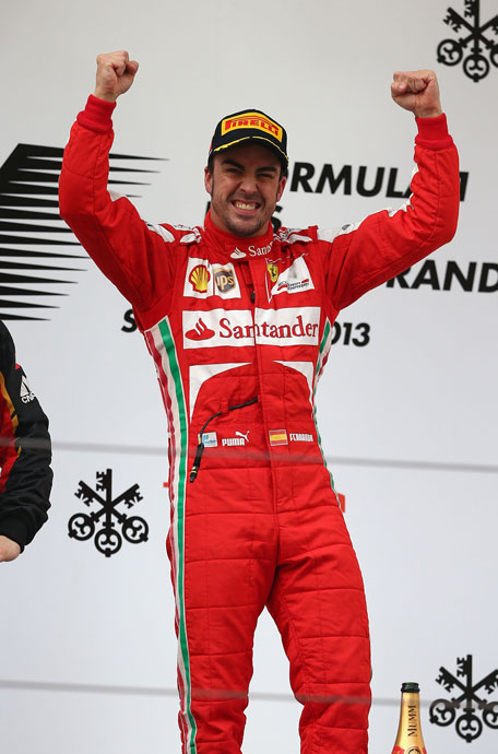 Fernando Alonso of Spain and Ferrari celebrates on the podium after winning the Chinese Formula One Grand Prix at the Shanghai International Circuit on April 14, 2013 in Shanghai, China. (GETTY)