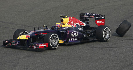 Red Bull Formula One driver Mark Webber of Australia loses his rear wheel as he drives during the Chinese F1 Grand Prix at the Shanghai International Circuit, April 14, 2013. (REUTERS)