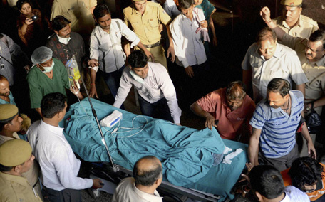 A 5-year-old girl, according to police, is wheeled into a hospital for treatment after she was raped and tortured in New Delhi, India. (AP)