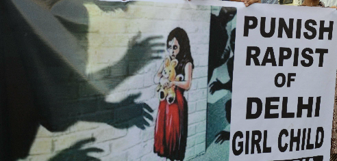 Indian protesters from the All-India Democratic Students Organisation and All-India Mahila Sanskritik Students Organisation demonstrate in Ahmedabad on April 20, 2013, against the brutal rape of a five-year old girl in New Delhi.  A five-year-old Indian girl who was abducted, repeatedly raped and tortured in New Delhi was on Saturday alert and in a stable condition but may need surgery, her doctors said. (AFP)