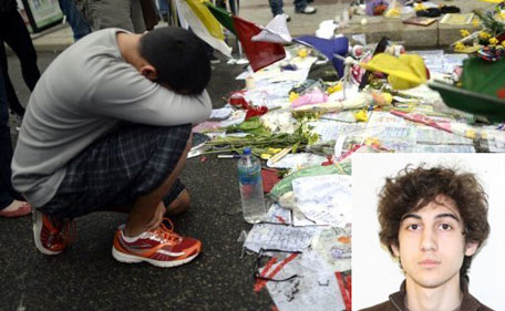 (Bottom Right) undated image released by the FBI shows Boston bombing suspect Dzhokhar Tsarnaev, April 19, 2013. People visit a make-shift memorial in Boston the morning after the remaining bombing suspect is caught (AFP)