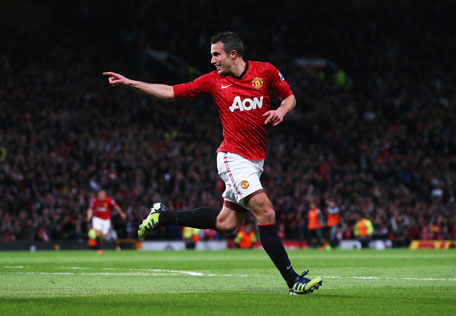 Robin van Persie of Manchester United celebrates scoring his hat trick goal during the Barclays Premier League match against Aston Villa at Old Trafford on April 22, 2013 in Manchester, England. (GETTY)