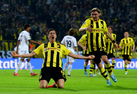 Robert Lewandowski of Borussia Dortmund celebrates after scoring his team's third goal during the UEFA Champions League semifinal first leg against Real Madrid at Signal Iduna Park on April 24, 2013 in Dortmund, Germany. (GETTY)