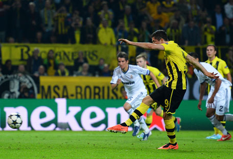 Robert Lewandowski of Borussia Dortmund scores his team's fourth goal from the penalty spot during the UEFA Champions League semifinal first leg against Real Madrid at Signal Iduna Park on April 24, 2013 in Dortmund, Germany. (GETTY)