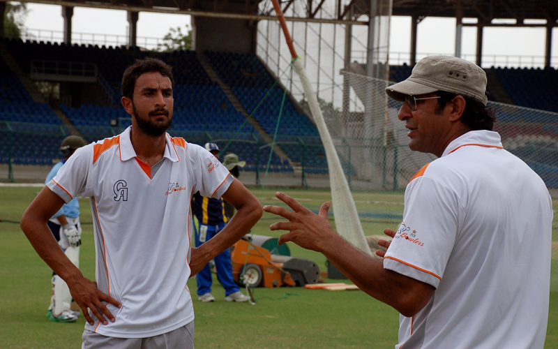 This handout photograph released by the Pakistan Cricket Board on April 29, 2013, shows Pakistani paceman Wasim Akram (R) giving tips to bowler Ahmed Jamal during a training camp in Karachi on April 21, 2013. Little-known bowler Ahmed Jamal has vowed to make a name for himself after winning a nationwide "King of Speed" competition launched by cricket chiefs to unearth a new Pakistani quick. (AFP)