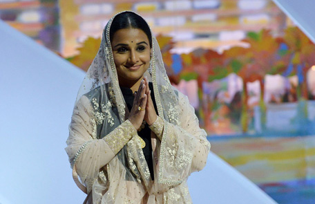 Indian actress and member of the Feature Film Jury Vidya Balan greets the audience on May 15, 2013 as she arrives on stage during the opening of the 66th edition of the Cannes Film Festival in Cannes. Cannes, one of the world's top film festivals, opens on May 15 and will climax on May 26 with awards selected by a jury headed this year by Hollywood legend Steven Spielberg. (AFP)