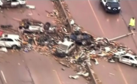 This photograph obtained courtesy of KWTV/CBS shows destruction in Moore, Oklahoma May 20, 2013 after a tornado ripped through in Oklahoma.  A powerful tornado with winds of up to 200 miles (320 kilometers) per hour pulverized an Oklahoma City suburb Monday hitting at least two schools and wiping out block after block of homes.  (AFP/KWTV/CBS)