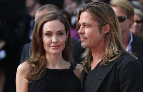 Brad Pitt and Angelina Jolie arrive for the World Premiere of World War Z  at a central London cinema, Sunday, June 2, 2013. (AP)