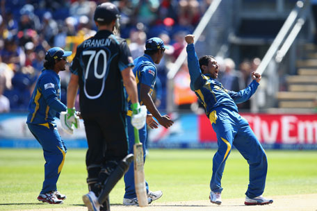 Tilakarathne Dilshan (right) of Sri Lanka celebrates capturing the wicket of James Franklin of New Zealand during the Group A ICC Champions Trophy match at the SWALEC Stadium on June 9, 2013 in Cardiff, Wales. (GETTY)