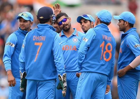 Ravindra Jadeja of India is centre of attention after dismissing Ramesh Sarwan of West Indies during the ICC Champions Trophy Group B match at The Oval on June 11, 2013 in London, England. (GETTY)