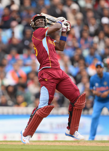 Darren Sammy of West Indies smashes a huge six during the ICC Champions Trophy Group B match against India at The Oval on June 11, 2013 in London, England. (GETTY)
