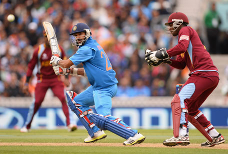 Shikar Dhawan of India cuts as wicketkeeper Johnson Charles of West Indies looks on during the ICC Champions Trophy Group B match at The Oval on June 11, 2013 in London, England. (GETTY)