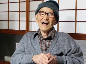 In this file photo taken Oct 15, 2012 and released by Kyotango City, Jiroemon Kimura smiles after he was presented with the certificate of the world’s oldest living man from Guinness World Records Editor-in-Chief Craig Glenday at his home in the city, Kyoto Prefecture, Japan. Japanese media report that Kimura died of natural causes at a hospital in Kyotango early Wednesday, June 12, 2013. (AP)