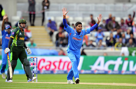 India's Umesh Yadav (R) appeals unsuccessfully for the wicket of Pakistan's Nasir Jamshed (L) during the 2013 ICC Champions Trophy cricket match between Pakistan and India at Edgbaston in Birmingham, central England, on June 15, 2013. Indian captain Mahendra Singh Dhoni won the toss and sent Pakistan in to bat in the last group B match of the Champions Trophy.  (AFP)