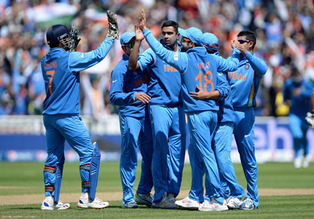 Ravichandran Ashwin of India celebrates with teammates after dismissing Kamran Akmal of Pakistan during the ICC Champions Trophy match at Edgbaston on June 15, 2013 in Birmingham, England. (GETTY)