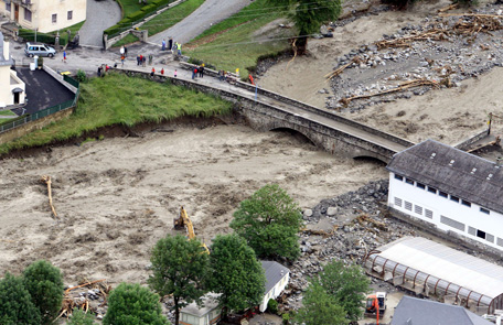 Aerial picture taken on June 19, 2013 shows the flooded river of Luz-Saint-Sauveur one day after unseasonal storms caused havoc across huge swaths of the country. (AFP)