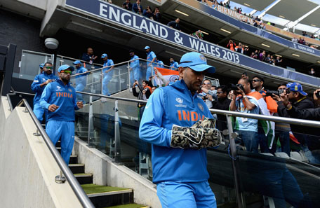 India captain MS Dhoni leads out his team ahead the ICC Champions Trophy match between India and Pakiatan at Edgbaston on June 15, 2013 in Birmingham, England. (GETTY)