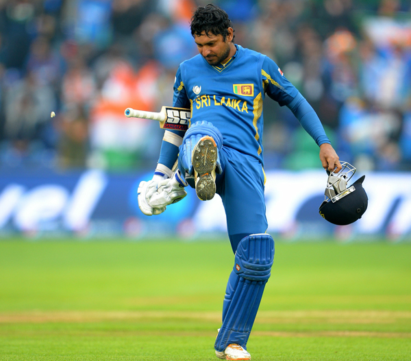Sri Lanka's Kumar Sangakkara kicks his chewing gum after getting out  during the 2013 ICC Champions Trophy semi-final cricket match between India and Sri Lanka at the Cardiff Wales Stadium in Cardiff, south Wales, on June 20, 2013. (AFP)