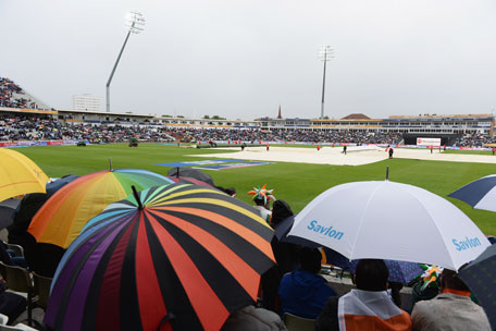 Spectators shelter from the rain with the covers on during the ICC Champions Trophy Final between England and India at Edgbaston on June 23, 2013 in Birmingham, England. (GETTY)